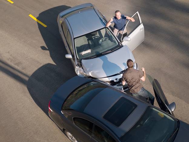 A person standing next to a car with another person standing next to him
AI-generated content may be incorrect.